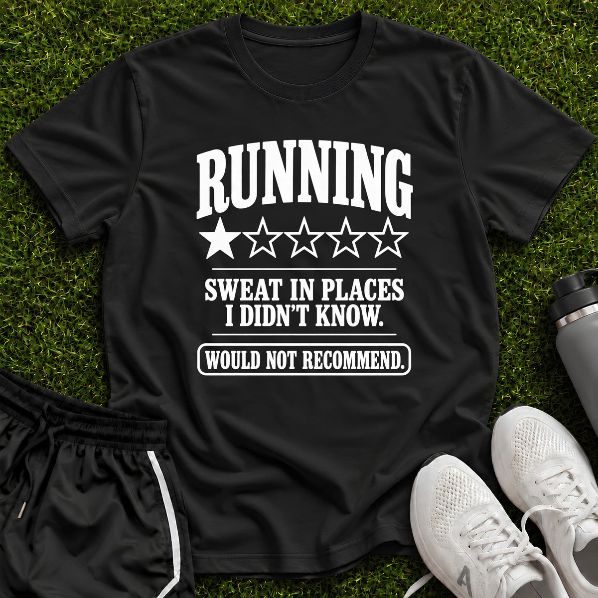 A black athletic t-shirt with a humorous white graphic print reading 'RUNNING SWEAT IN PLACES I DIDN'T KNOW. WOULD NOT RECOMMEND.